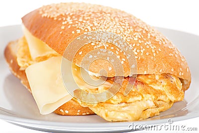 Breakfast Sandwich with Bacon and Fried Scrambled Egg. Stock Photo