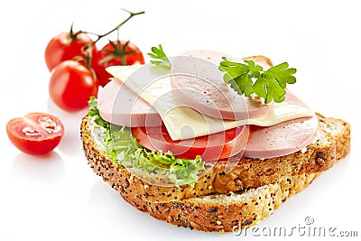 Breakfast sandwich with sliced sausage and tomato Stock Photo