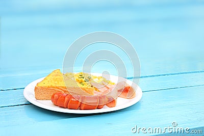 Breakfast scrambled egg sausage toast bread Stock Photo