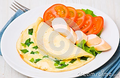 Breakfast. scrambled eggs, sausage and tomatoes Stock Photo