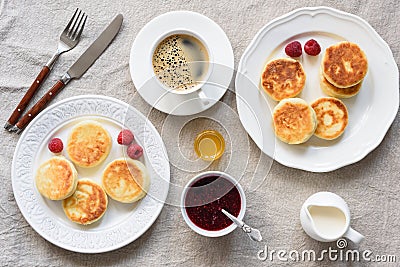Breakfast Table Cottage Cheese Pancakes, Coffee, Cream, Honey and Jam Stock Photo