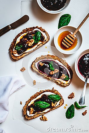 Breakfast table with healthy toasts on white background Stock Photo