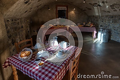 Breakfast table in rural stone farmhouse Stock Photo