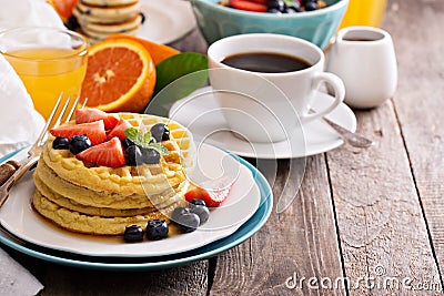 Breakfast table with stack of waffles Stock Photo