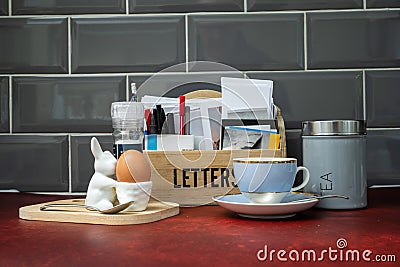 breakfast time with a boiled egg earl grey tea whilst opening the morning mail Stock Photo