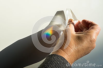 Breaking and dispersion of light in a prism, beautiful rainbow colors. Stock Photo