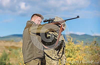 Breaking law. Poaching concept. Activity for brutal men. Hunters poachers looking for victim. Poachers with rifles in Stock Photo