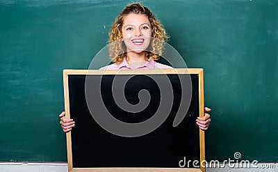 Breaking news. Teacher cheerful woman hold blackboard blank copy space. School information concept. School bell schedule Stock Photo