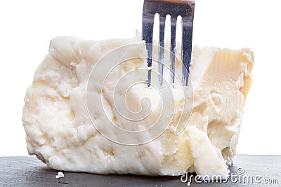 Breaking semisoft crumbly feta with a fork Stock Photo