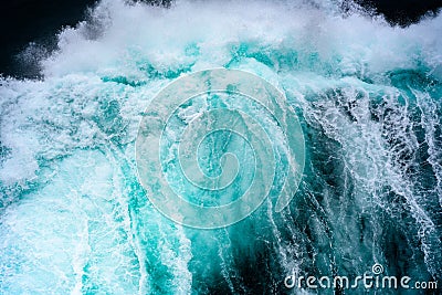 Breaking turquoise wave, splashing water drops, very sharp Stock Photo