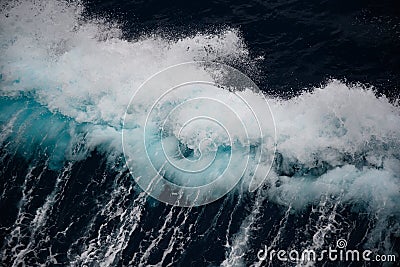 Breaking turquoise wave, splashing water drops, very sharp Stock Photo