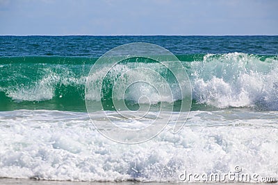 Breaking wave at the beach Stock Photo