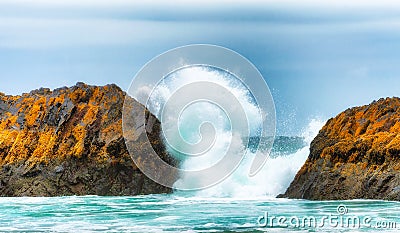 Breaking Waves Between Intertidal Rocks Stock Photo