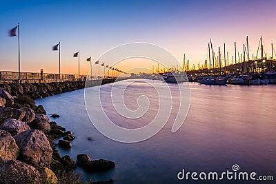 Breakwater and boats at the harbor at sunset, in Santa Barbara, Editorial Stock Photo