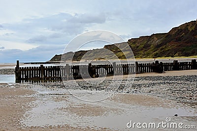 Breakwater and Eroded CLiffs, Overstrand, Cromer, Norfolk, UK Stock Photo