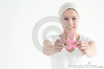 Breast cancer survivor holding ribbon Stock Photo