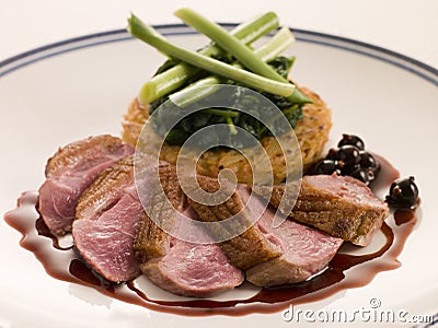 Breast of Duck, with Rosti Potato and Cassis Jus Stock Photo