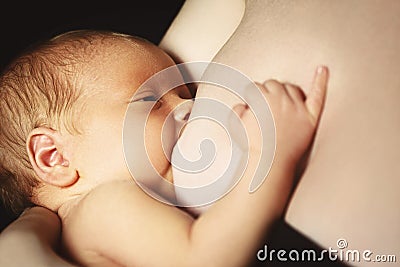 Breast-feeding. mother feeds newborn baby with breast Stock Photo