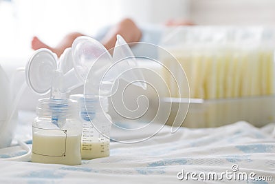 Breast milk frozen in storage bag and baby lying Stock Photo