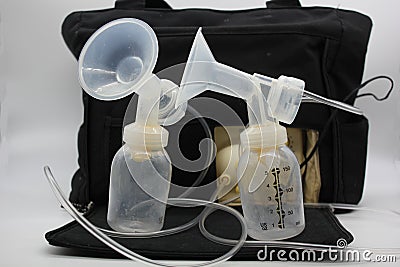 Breast Milk Pump with Flange and Bottles Stock Photo