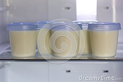 Breast milk storage stored in the back of refrigerator Stock Photo