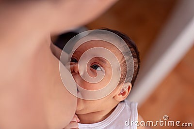 Breastfeeding baby - Young mother breastfeeding the newborn baby Stock Photo