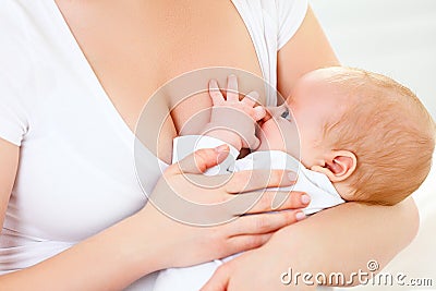 Breastfeeding. mother holding newborn in embrace and breastfeed Stock Photo