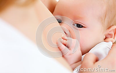 Breastfeeding. mother holding newborn in embrace and breastfeed Stock Photo