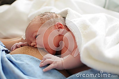 Breastfeeding a newborn Stock Photo