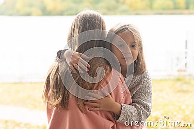 Breath portraits of little girls outside in summer, standing together Stock Photo