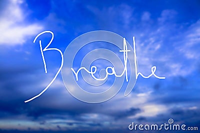 Breathe Handwritten logo in the sky Stock Photo