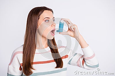 Breathing in bronchospasm attack spray lady wear striped pullover isolated white background Stock Photo