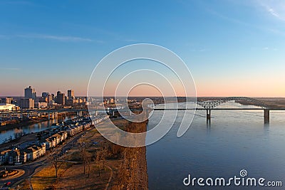 A breathtaking aerial shot of the running waters of the Mississippi river with powerful clouds and a stunning sunset Stock Photo