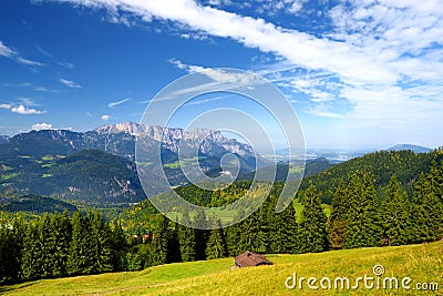 Breathtaking lansdcape of mountains, forests and small Bavarian villages in the distance. Scenic view of Bavarian Alps with majest Stock Photo