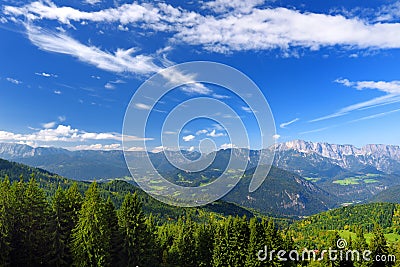 Breathtaking lansdcape of mountains, forests and small Bavarian villages in the distance. Scenic view of Bavarian Alps with majest Stock Photo