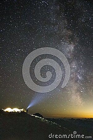 the milky above a hill on a clear night with mountains and stars Stock Photo