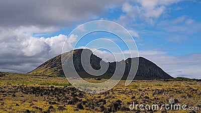 Breathtaking view of the grassfields leading up to the Rano Raraku crater. Stock Photo