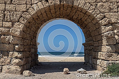 Breathtaking view of a historic Roman Aqueduct located in Caesarea, Israel Stock Photo