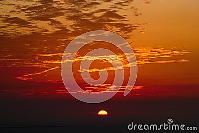 Breathtaking view of a mesmerizing cloudy sky during a scenic sunset Stock Photo