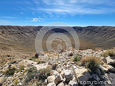 Stunning view of a mountainous landscape featuring rugged rock formations: Meteor crater in Arizona Stock Photo