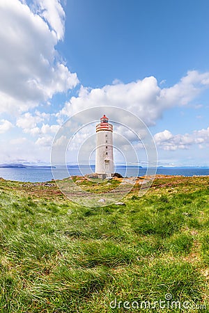 Breathtaking view of Skarsviti lighthouse in Vatnsnes peninsula on a clear day in North Iceland Stock Photo