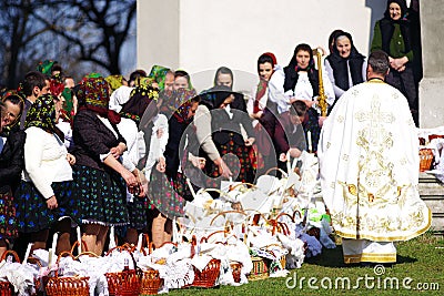 BREB, ROMANIA - 29 APRIL, 2019 - Local peasants dressed in traditional clothes, celebrating the Easter Holidays, Maramures. Editorial Stock Photo