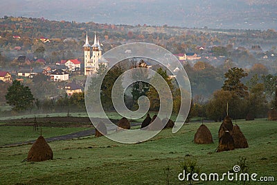 breb maramures in autumn fog traditional Romanian village Stock Photo