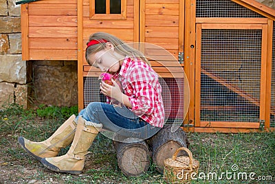 Breeder hens kid girl rancher farmer with chicks in chicken coop Stock Photo