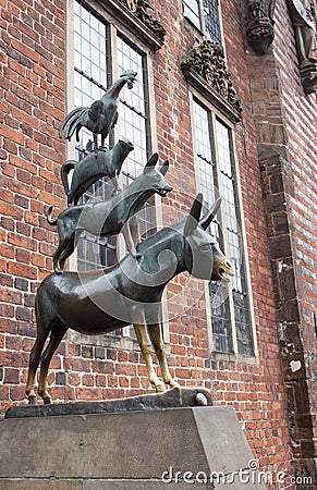 Bremen, Germany - 06/13/2019: famous sculpture of Bremen musicians. Bronze monument of fairytale animals. Grimm brothers heritage. Editorial Stock Photo