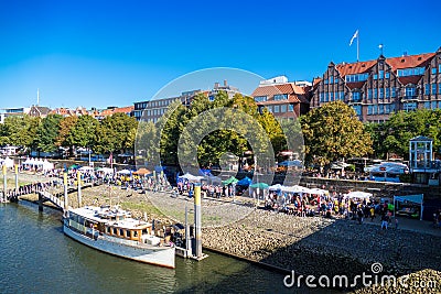 BREMEN, GERMANY - September 22, 2019: View to famous Weser promenade Schlachte with Dragon Boat Festival Editorial Stock Photo