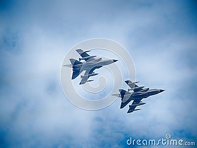 Fighter planes speeding through the sky armed with bombs during a military exercise Editorial Stock Photo