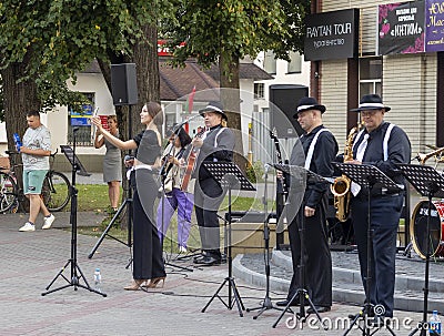 Brest, Belarus - 08.25.2023 - Jazz street band performing for public. Entertainment Editorial Stock Photo