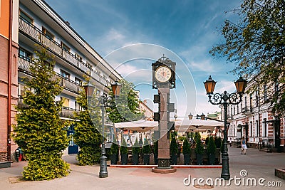 Brest, Belarus. Clock With Arms Of City Of Different Times On Pedestrian Sovietskaya Street In Summer Day. Editorial Stock Photo