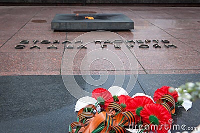 Flowers on the Tombstone of Unknown Soldier and Eternal Light Editorial Stock Photo